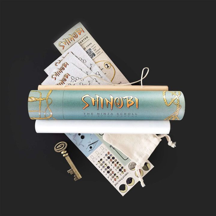 Board game components for 'Shinobi: The Ninja Scroll' arranged on a black surface, including a game scroll, ninja figures, and a key. Games Night in an envelope and tabletop Escape Room Game. Similar to an Exit Game. Same genre as murder mystery.